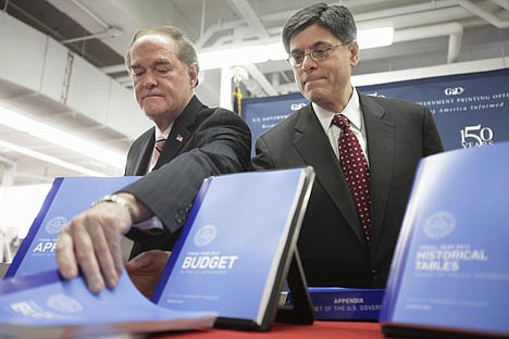 &lt;p&gt;Public Printer of the United States Bill Boarman, left, and Budget Director Jacob Lew, look at printed copies of the fiscal 2012 federal budget Thursday at the U.S. Government Printing Office (GPO) in Washington.&lt;/p&gt;