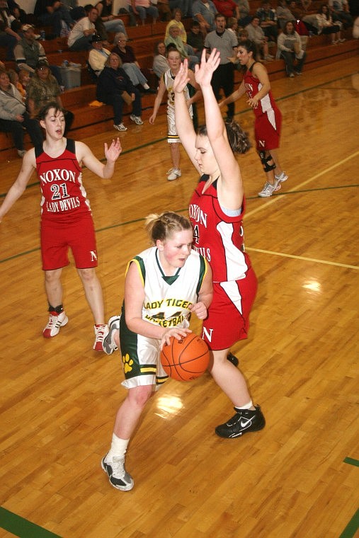 St. Regis Lady Tiger Tyler Cheesman drives down the court during a game against the Noxon Lady Red Devils Saturday night. The Lady Tigers lost the game 57-37