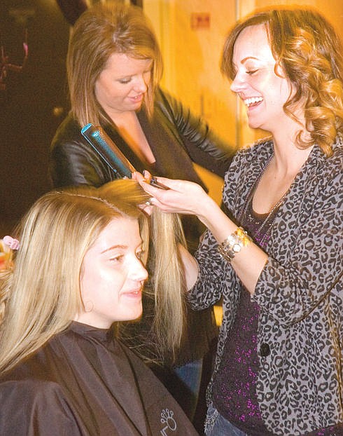 &lt;p&gt;David Reese/Lake County Leader Dylen Zetterberg, right, styles Taylor Ramstad's hair at the Mission Mountain Bridal Fair Saturday in Polson. Zetterberg is with Polson's Cutting Edge salon. In the background is Marete Frame.&lt;/p&gt;