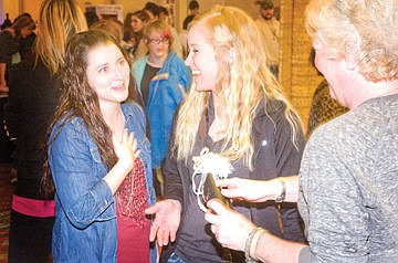 &lt;p&gt;David Reese/Lake County Leader Jordan DuMont, left, tries out makeup with Kaylee Larson, center, and Jule Mason at the Mission Mountain Bridal Fair Saturday in Polson. DuMont is a bridesmaid in Larson's June 20 wedding, and Mason represents Younique cosmetics.&lt;/p&gt;