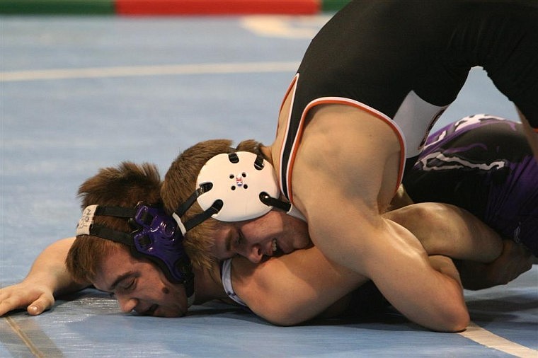 Taylor Vaughn of Lincoln County claims an 8-2 decision over Kyle Fulton of Forsyth in the Class B-C 160-pound semifinals. Vaughn wound up second.