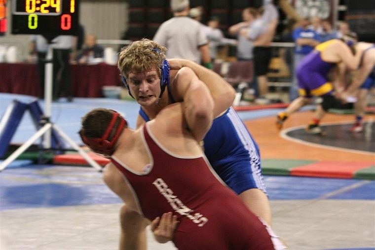 Columbia Falls&#146; Kelly Houle pins Paul Donaldson of Hamilton in the semifinals of the Class A 215-pound weight class. Houle took first place with four straight pins in the tournament.