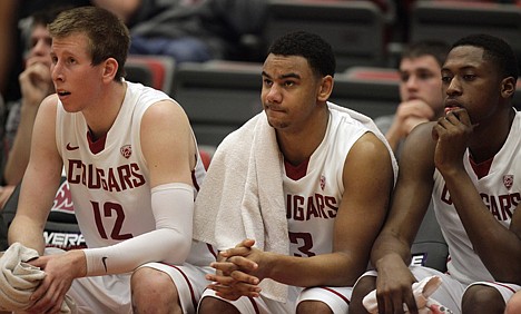 &lt;p&gt;Washington State'S Brock Motum (12), DaVonte Lacy (3) and Junior Longrus watch the action from the bench during the first half Wednesday night at Pullman. The Cougars lost to Oregon State 67-66.&lt;/p&gt;