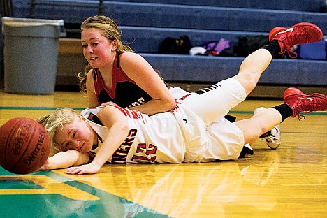 &lt;p&gt;Wallace High's Morgan Hill (12) and Lakeside's Jory Chittenden dive to the floor for a loose ball Thursday in the 1A Division 1 District 1 girls basketball tournament at Lake City High School in Coeur d&Otilde;Alene.&lt;/p&gt;