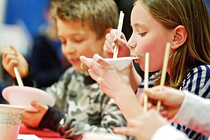 &lt;p&gt;JEROME A. POLLOS/Press Peja Hall tries out her newly learned chop stick skills Wednesday during Fernan Elementary's after school Geography Club. Students learned about Asia's culture, environment, economy and food through the program that was funded by an EXCEL grant and supported through parents and the school's Parent-Teacher Association. Wednesday's meeting ended with a meal of Chinese food donated by Panda Express.&lt;/p&gt;