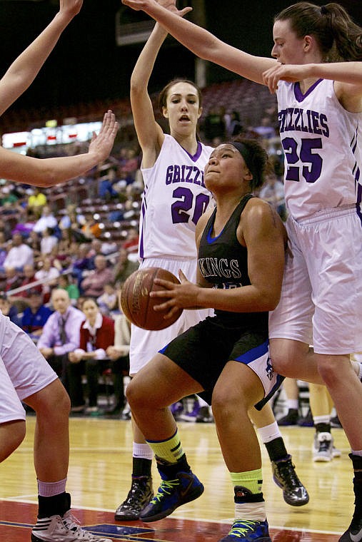 &lt;p&gt;JEROME A. POLLOS/Press Kendalyn Brainard from Coeur d'Alene High is surrounded by Rocky Mountain defenders as she looks for a shot from under the hoop.&lt;/p&gt;