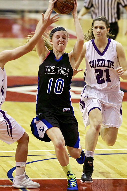 &lt;p&gt;JEROME A. POLLOS/Press Coeur d'Alene High's Caelyn Orlandi drives the lane in front of Maya Rodgers from Rocky Mountain High during the second half.&lt;/p&gt;