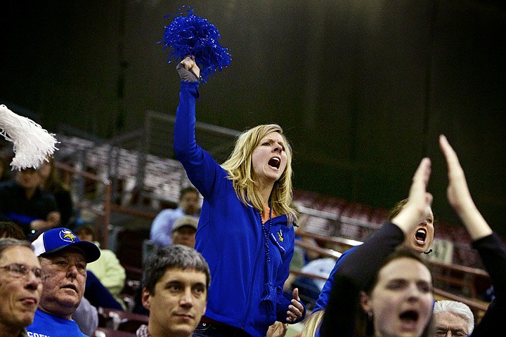 &lt;p&gt;JEROME A. POLLOS/Press Anne Sumner cheers on her daughter Madison and her teammates during the second half of Coeur d'Alene High's 55-36 win over Rocky Mountain High in the Idaho 5A State Basketball Championship tournament Thursday at the Idaho Center in Nampa.&lt;/p&gt;