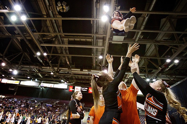 &lt;p&gt;JEROME A. POLLOS/Press Post Falls High cheerleader Abby Danielson falls toward the awaiting arms of her teammates as they celebrate the Trojan's 50-28 win Thursday over Mountain View High in the Idaho 5A State Championship tournament at the Idaho Center in Nampa.&lt;/p&gt;