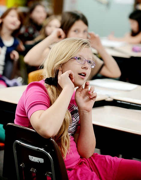 <p>Fourth-grader Kaya Fiedor learns the Spanish word for ears.</p>