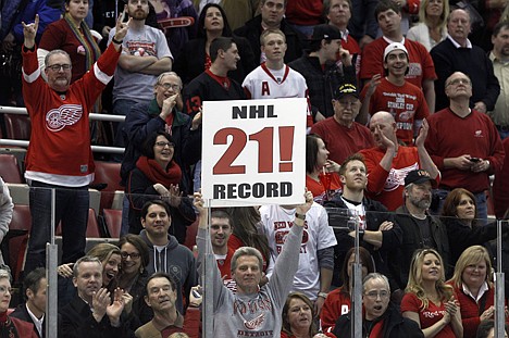 &lt;p&gt;Fans celebrate the Detroit Red Wings' 3-1 win over the Dallas Stars in an NHL hockey game in Detroit, Tuesday, Feb. 14, 2012. Detroit set an NHL record with 21 consecutive home victories. (AP Photo/Paul Sancya)&lt;/p&gt;