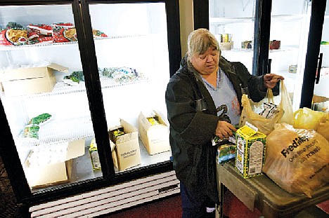 &lt;p&gt;Nancy Kadrmas organizes the groceries she chose Tuesday at the Community Action Partnership food bank in Coeur d&#146;Alene. A proposed House bill and the proposed 2012 budget would call for significant cuts to the Community Services Block Grant, which funds Community Action Partnership services.&lt;/p&gt;