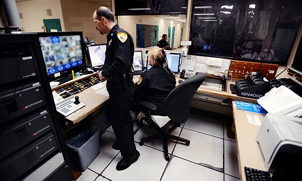 &lt;p&gt;DETENTION COMMANDER BILL SMITH and Officer Alta Miles work in the control room of the Flathead County Detention Center in Kalispell on Feb. 5. The control room and adjoining booking area would receive the bulk of improvements to be recommended by Flathead County Sheriff Chuck Curry.&lt;/p&gt;