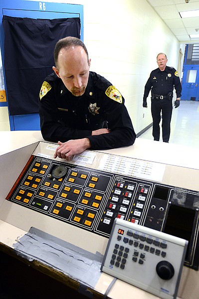 &lt;p&gt;Detention Center Commander Bill Smith leans over the door control panel on the second floor on Tuesday, February 5. (Brenda Ahearn/Daily Inter Lake)&lt;/p&gt;