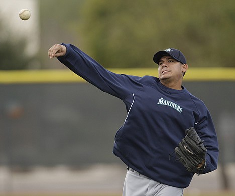 &lt;p&gt;Seattle Mariners starting pitcher Felix Hernandez throws during spring training baseball Tuesday, Feb. 14, 2012, in Peoria, Ariz. (AP Photo/Charlie Riedel)&lt;/p&gt;