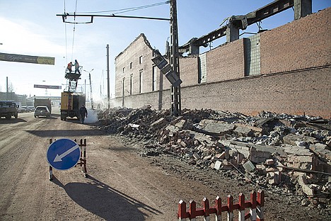 &lt;p&gt;In this photo provided by Chelyabinsk.ru, municipal workers repair damaged electric power circuit outside a zinc factory building with about 6000 square feet of a roof collapsed after a meteorite exploded over in Chelyabinsk region on Friday.&lt;/p&gt;