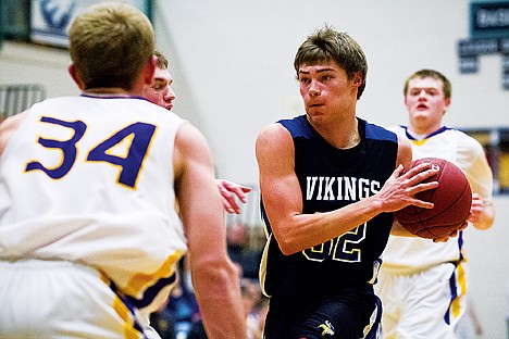 &lt;p&gt;Coeur d'Alene High's Devon Kluss drives to the hoop in the third quarter against Lewiston on Friday during the 5A Region 1 boys basketball tournament at Lake City.&lt;/p&gt;