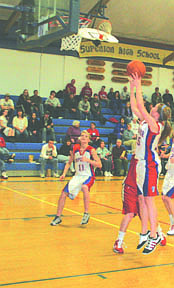 Nicole Stroot takes a shot while Kelsey Stenberg looks on.