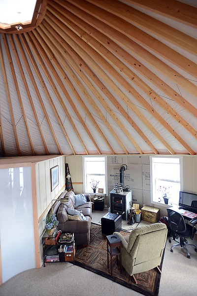 <p>McDonald added numerous upgrades, such as extra insulation, a kitchen with an island and carpeting in the main room, which is 30 by 15 feet. Her heating woodstove also doubles as a kitchen stove, with a cooktop and wood-fired oven.</p>