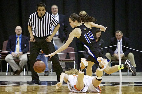 &lt;p&gt;Brittany Tackett from Coeur d'Alene High tries to avoid a collision with Post Falls High's Hallie Gennett.&lt;/p&gt;