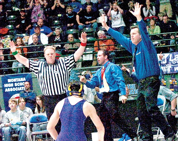 Libby coach Mort Curtiss, right, reacts to Kyle Leir's state title on Saturday.