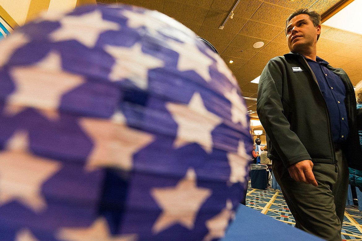 &lt;p&gt;SHAWN GUST/Press Jim Burton walks past a booth at the chamber&#146;s annual business fair.&lt;/p&gt;