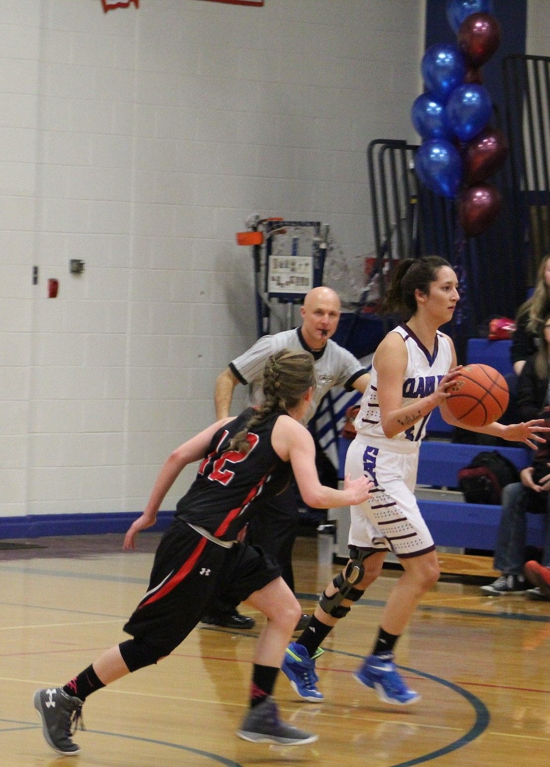 &lt;p&gt;Lady Cat Celein Parkin charges past Darby in last week's game.&lt;/p&gt;