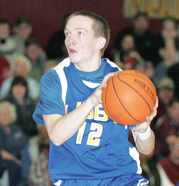 Libby's Reese Jensen looks to pass against Troy.