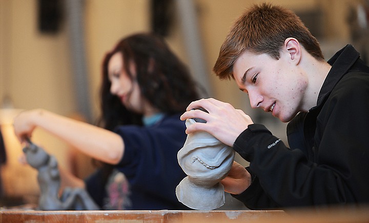 &lt;p&gt;Kade Deleray, a junior, and Hanna Grant, a senior, work on ceramics projects on Thursday at Glacier High School.&lt;/p&gt;