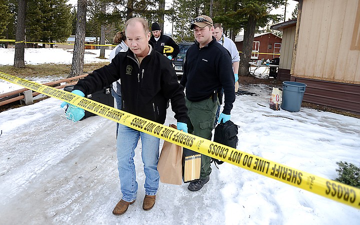 &lt;p&gt;Kipp Tkachyk, Colten O&#146;Connell and other members of the Flathead County Sheriff&#146;s Office investigate the scene of a fatal shooting in Hungry Horse.&lt;/p&gt;