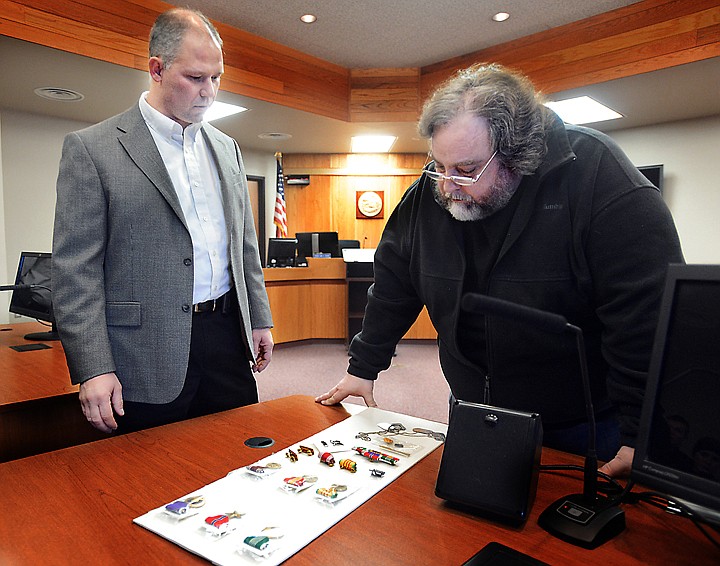 &lt;p&gt;Kalispell Police Chief Roger Nasset, left, and Greg Smith look over medals belonging to Smith&#146;s brother that were stolen on Jan. 9. After the medals, including a Purple Heart and Bronze Star, were found and restored, they were returned to Smith on Tuesday.&lt;/p&gt;