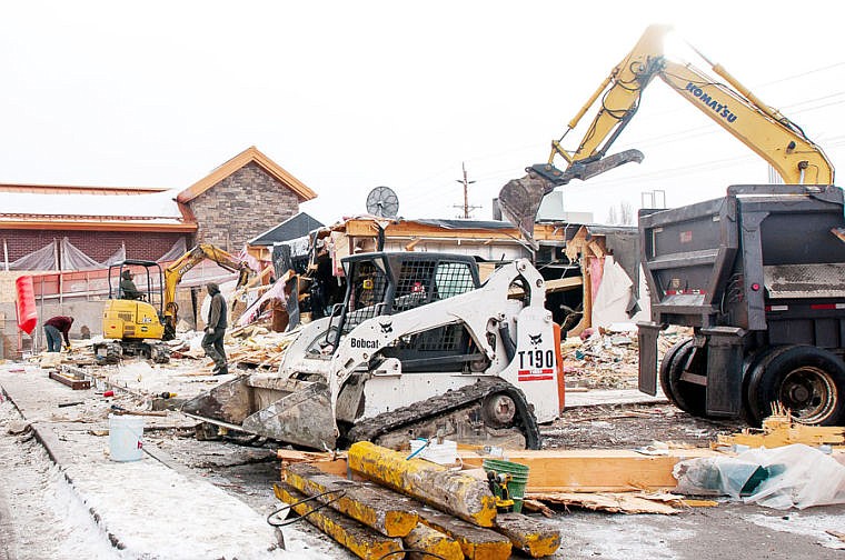 &lt;p&gt;Robinson Sand &amp; Gravel crews tear down the Town Pump convenience store and Magic Diamond Casino Wednesday morning at the intersection of Reserve Drive and U.S. 2 in Evergreen. A new convenience store and casino, built by Swank Enterprises starting in mid-July last year, is now open for business. A new island of fuel pumps and more parking will be built later this spring.&lt;/p&gt;