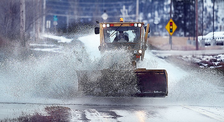 &lt;p&gt;A grader pushes its way through a large puddle on Willow Glen Drive on Thursday afternoon, February 13, in Kalispell. (Brenda Ahearn/Daily Inter Lake)&lt;/p&gt;