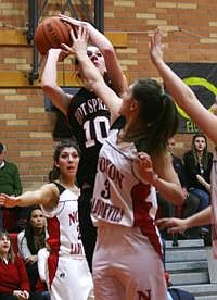 Meghan Massinglae of Hot Springs shoots over a Noxon defender in the Lady Heat's win at Noxon.