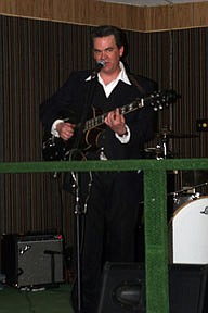 Merle Peterson does his best Johnnie Cash immitation during the Cold Hard Cash Show's performance at the Shelton's Annual Fundraiser on Saturday night at the VFW hall in Plains.