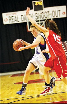 &lt;p&gt;Coeur d'Alene High's Kyeli Parker, left, sprints past Aleah Lowber from Boise during the first half of the Vikings' state 5A basketball tournament opener at the Idaho Center in Nampa.&lt;/p&gt;