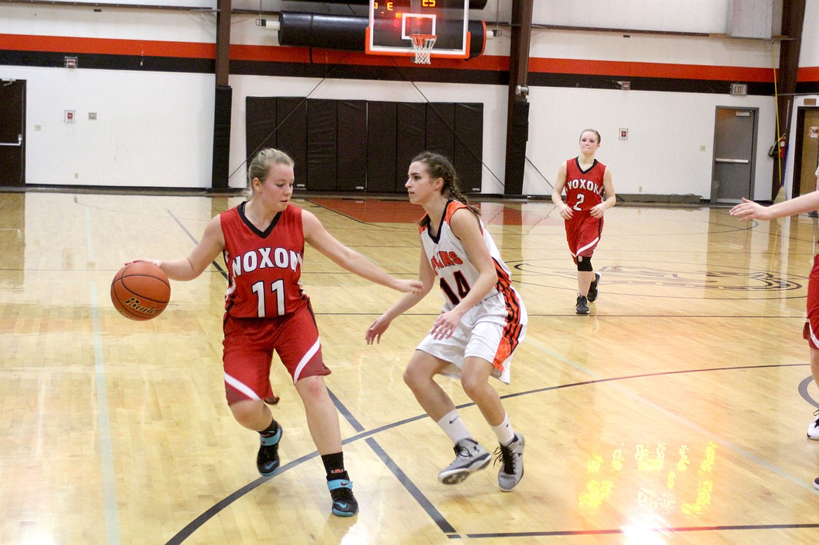 &lt;p&gt;&lt;strong&gt;Asiah Jenson looks for an opening to dodge around Sannon Dimond during Noxon&#146;s game against Plains.&lt;/strong&gt;&lt;/p&gt;