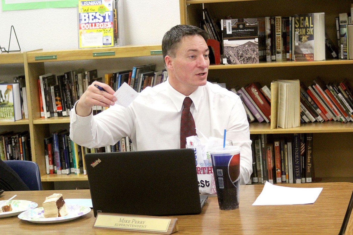 &lt;p&gt;&lt;strong&gt;Superintendant Dr. Mike Perry shows a Hot Buck to the school board members as he explains how the student rewards program works.&lt;/strong&gt;&lt;/p&gt;