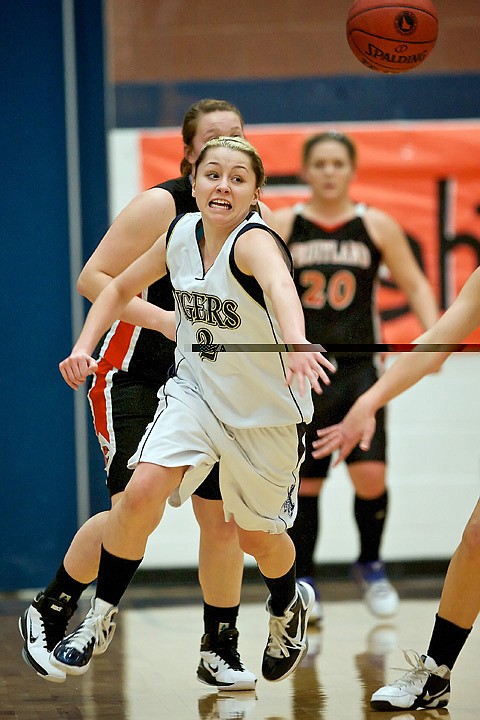 <p>Timberlake High's Kara Wenstrom chases down a loose ball after she knocked it away from a Fruitland High guard during the first half of Thursday's game.</p>