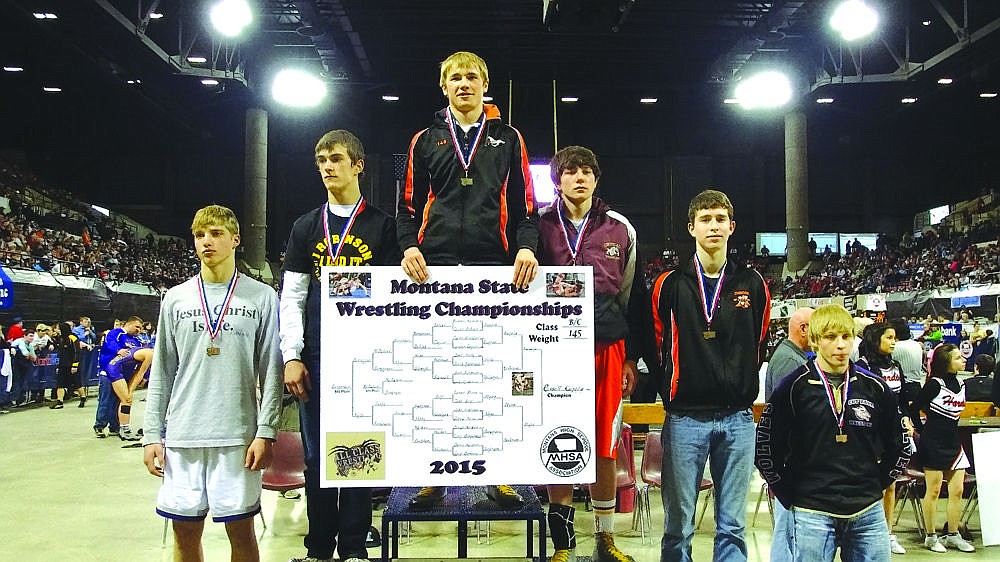 &lt;p&gt;Plains-Hot Springs 145-pound wrestler, Russell Kujala stands on top of the podium following last weekend's B-C State Tournament in Billings. With the state championship, Kujala, a senior, became the first Savage Horsemen wrestler to win two state championships.&lt;/p&gt;