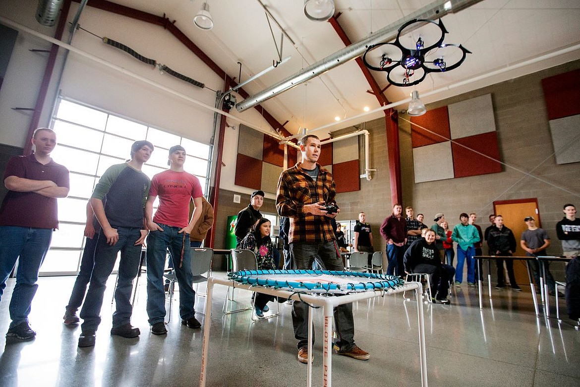 &lt;p&gt;Students at Kootenai Technical Education Campus watch a remote-controlled quad-copter, manned by Inland Northwest Aviation Club President Shaun Andrews, center, as it begins an in-air obstacle course on Wednesday at the school in Post Falls.&lt;/p&gt;