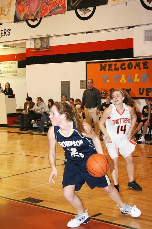 Jamie Doran/Valley Press Lady Hawk Rheanna Padden dribbles the ball past Trotter Chelsea Roosma Thursday night during the Lady Hawk's victory.