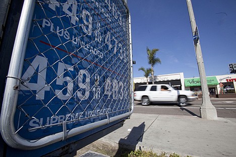 &lt;p&gt;A sign displays gas prices at a gas station Friday in San Diego.&lt;/p&gt;