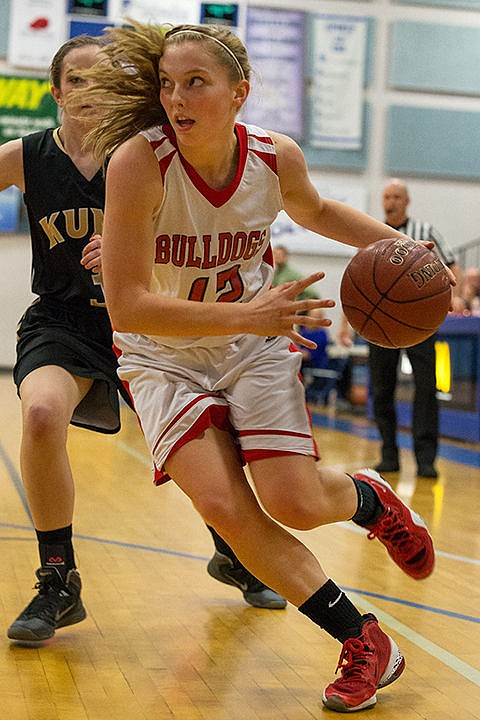 &lt;p&gt;Sandpoint&#146;s Madi Schoening drives past a Kuna defender to the basket in the third quarter.&lt;/p&gt;