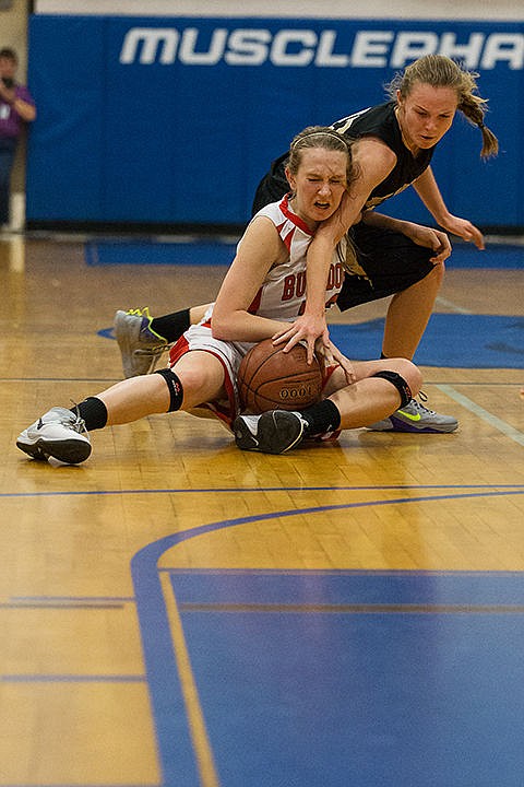 &lt;p&gt;Sandpoint High School&#146;s Grace Kirscher battles Meghan Holloman, of Kuna High, in the third period of the Idaho state 4A girls basketball tournament at Timberline High School Thursday in Boise.&lt;/p&gt;