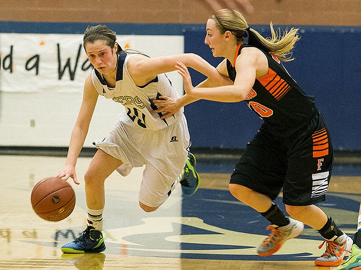 &lt;p&gt;Timberlake High School&#146;s Allison Kirby drives past Fruitland&#146;s Mackenzie Collins in the fourth quarter of the Idaho state 3A tournament Thursday in Nampa. Timberlake won the first round 47-43.&lt;/p&gt;