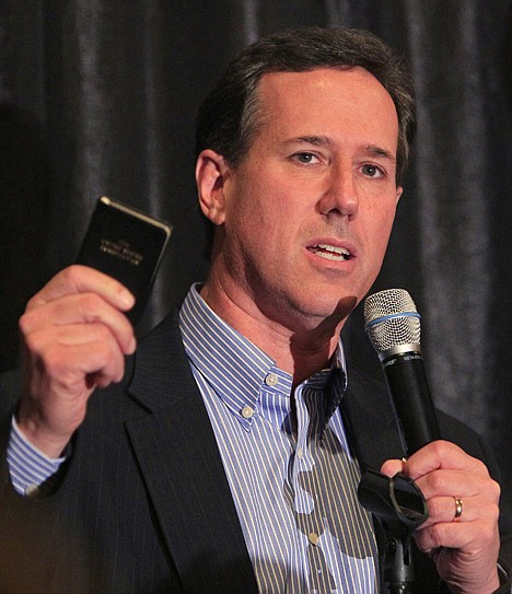<p>Republican presidential candidate, former Pennsylvania Sen. Rick Santorum, holds a small copy of the U.S. Constitution during a speech Friday at a Republican dinner in Mason, Ohio.</p>