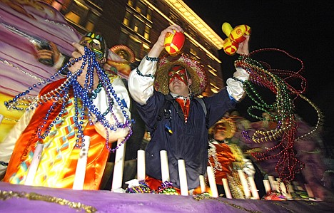 &lt;p&gt;A reveler with the Order of Incas tosses trinkets to the crowds gathered on Royal Street in Mobile, Ala., on Feb. 10. The pre-Lenten blowout continues along the Gulf Coast culminating in Fat Tuesday celebrations next Tuesday.&lt;/p&gt;