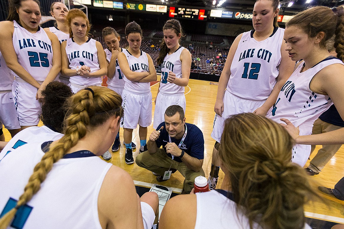 &lt;p&gt;SHAWN GUST/Press During a timeout in the third quarter, Lake City girls basketball coach Bryan Kelly encourages his team to &#147;keep battling.&#148;&lt;/p&gt;