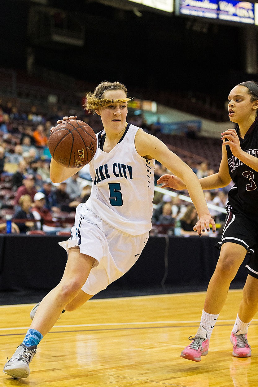 &lt;p&gt;SHAWN GUST/Press Bridget Rieken, a post for Lake City, drives toward the basket in the fourth quarter against Centennial High School.&lt;/p&gt;